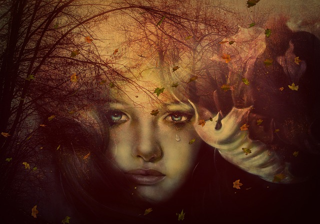 A young grieving woman is crying. The surround is trees with bare branches.