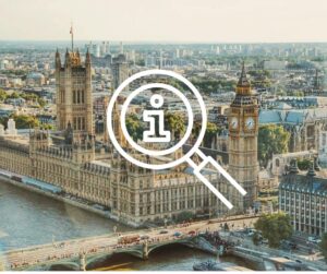 View of the Houses of Parliament in London, in the foreground is a river.